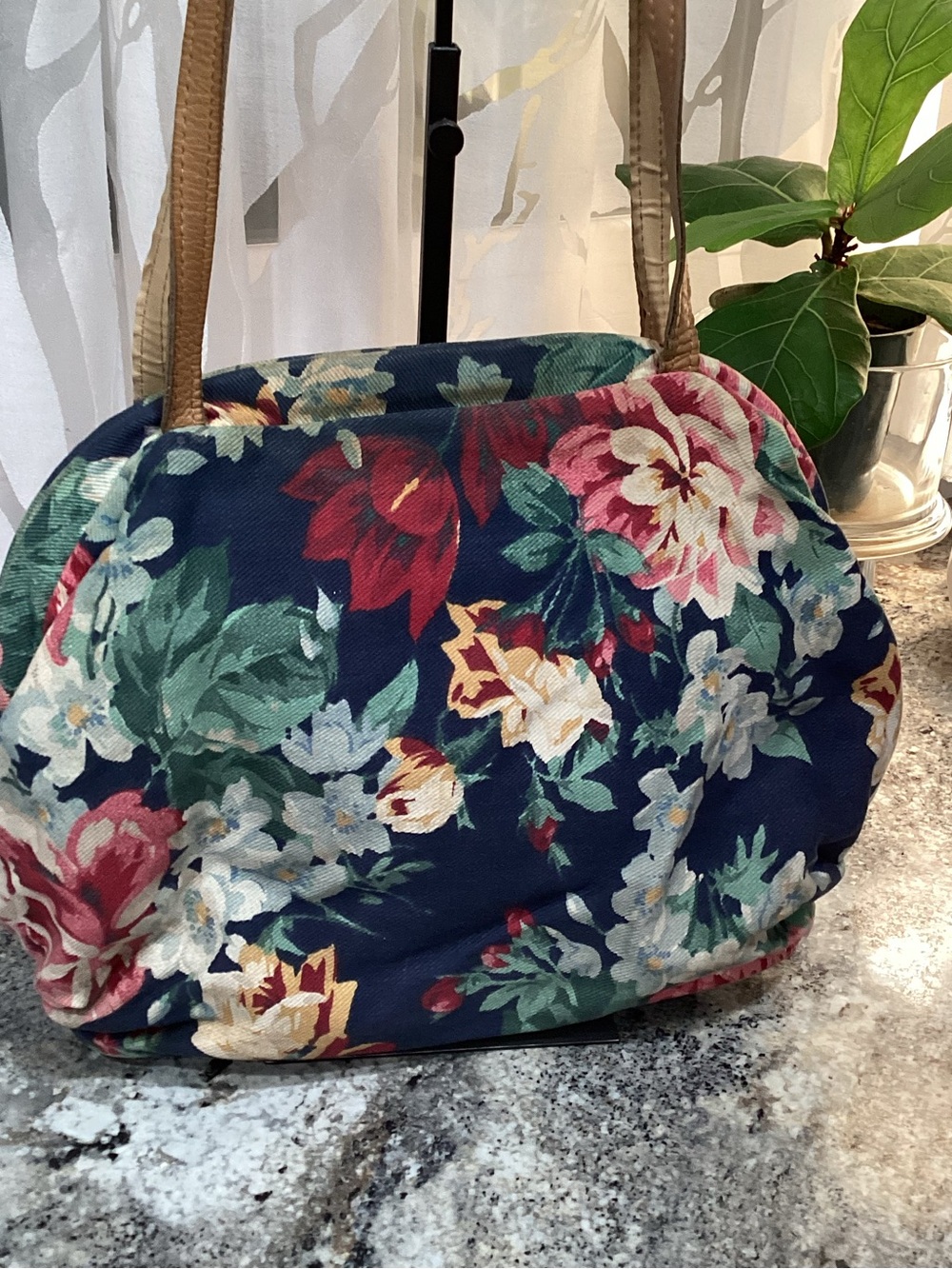 Vintage, hinged fabric bag with leather handles.